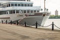 White ship at the pier of river station in Moscow